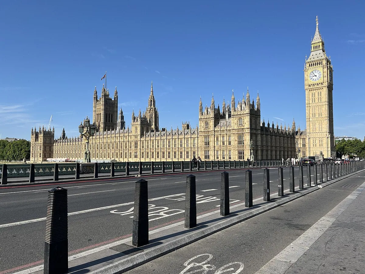 The view of the Palace of Westminster from a path across Westminster Bridge