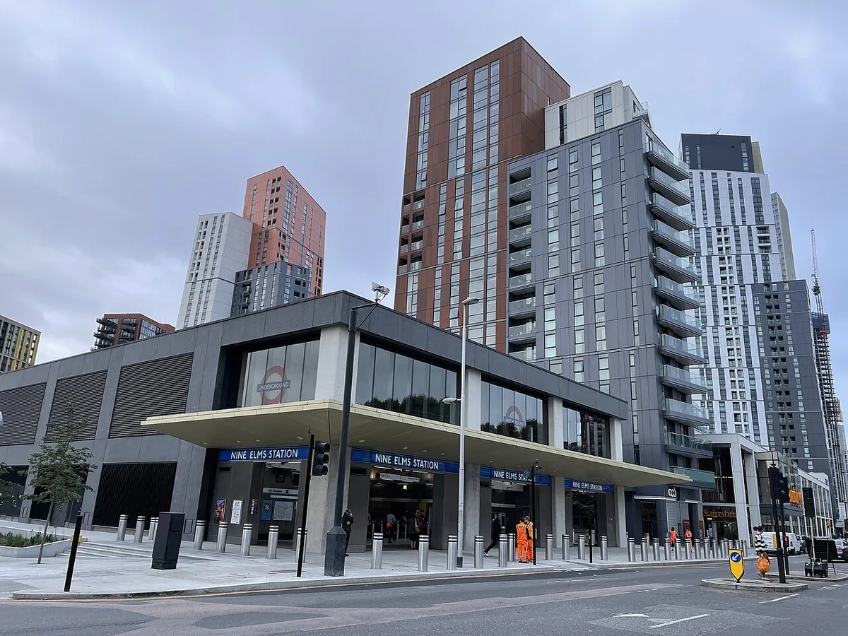 Opening day at Nine Elms tube station, with towers of new development behind